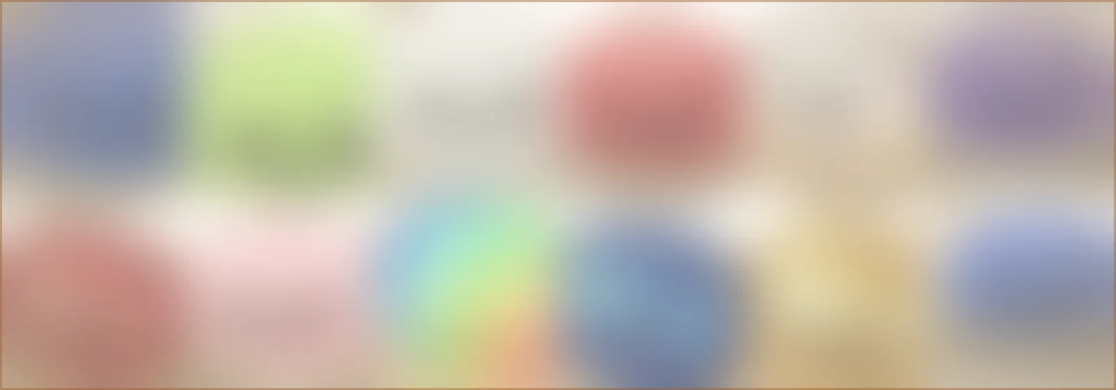 Bandeau de couleurs estompées reprenant les neuf nuances de la palette